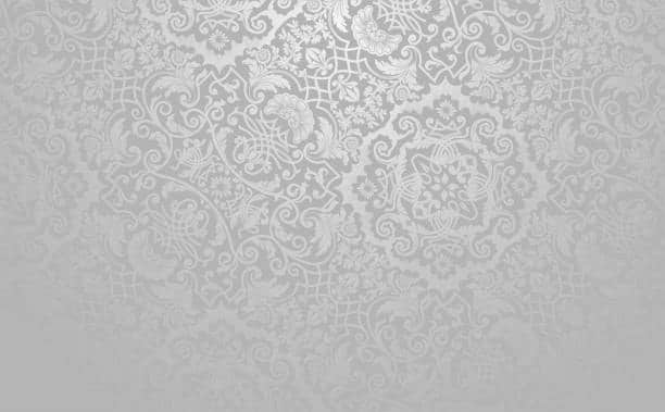 Intricate damask pattern on fabric, representing a decorative cloth fabric type often used in formal textile apparel.