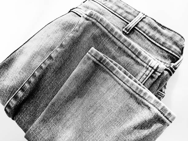 Black-and-white image of folded jeans, highlighting a style used to determine yards of fabric needed for a sewing project.