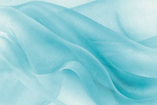 Light blue chiffon fabric showcasing its sheer and lightweight properties.